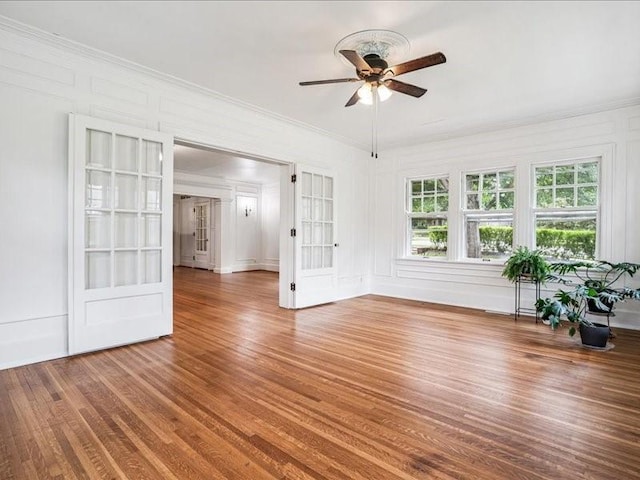 206 Kingbard Blvd, Waterloo, IA 50701 - empty room featuring ceiling fan, crown molding, and wood finished floors