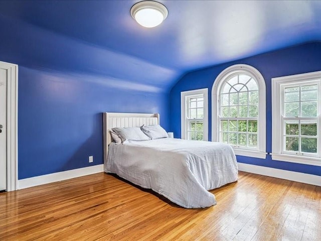 206 Kingbard Blvd, Waterloo, IA 50701 - bedroom with lofted ceiling and hardwood / wood-style floors