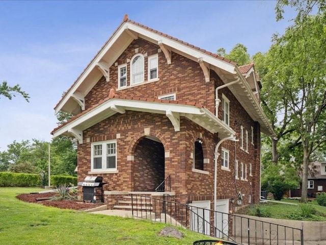 206 Kingbard Blvd, Waterloo, IA 50701 - view of front facade with an attached garage and brick siding