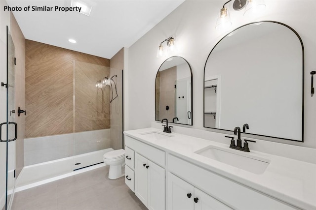 6706 Lauder Ln NE, Cedar Rapids, IA 52411 - bathroom with double vanity, tile patterned flooring, and a stall shower