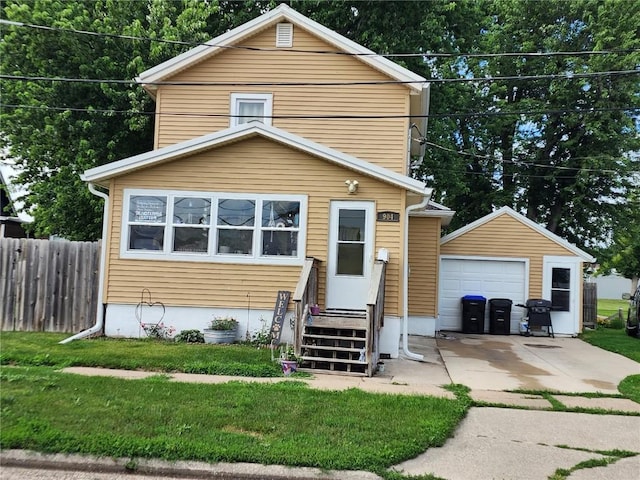 904 10th St, Belle Plaine, IA 52208 - view of front of property with a detached garage, an outbuilding, and driveway