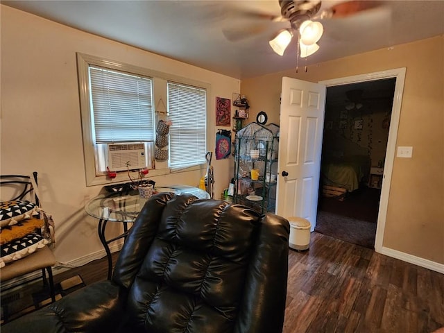 904 10th St, Belle Plaine, IA 52208 - dining space with cooling unit, dark wood-style floors, and a ceiling fan