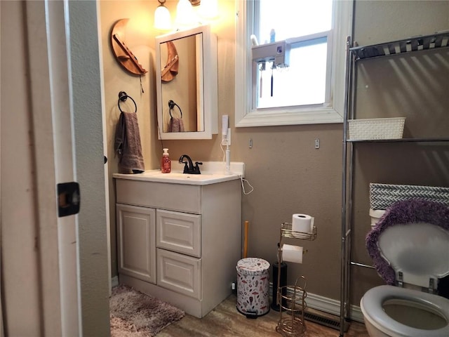904 10th St, Belle Plaine, IA 52208 - bathroom with vanity and wood finished floors