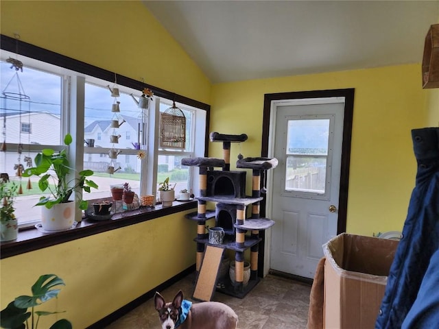 904 10th St, Belle Plaine, IA 52208 - interior space with healthy amount of natural light and vaulted ceiling