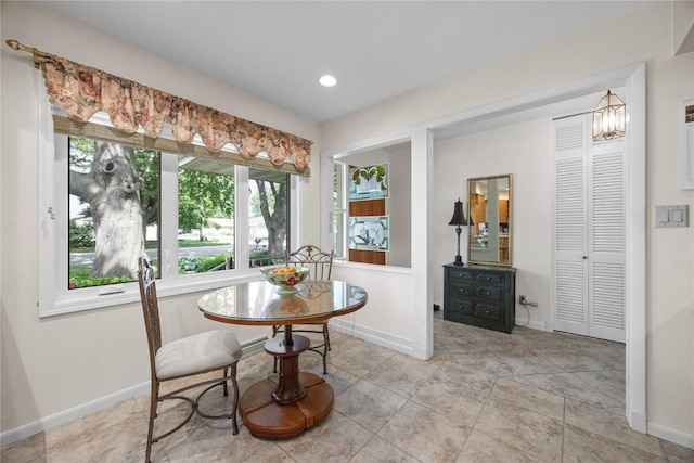 1104 Mulberry St, Tipton, IA 52772 - dining space featuring baseboards and recessed lighting
