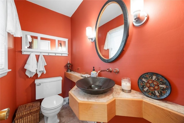 1104 Mulberry St, Tipton, IA 52772 - bathroom with a sink and tile patterned floors