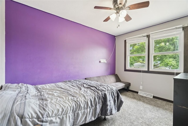 1708 Woodside Ct NW, Cedar Rapids, IA 52405 - carpeted bedroom with baseboards and ceiling fan