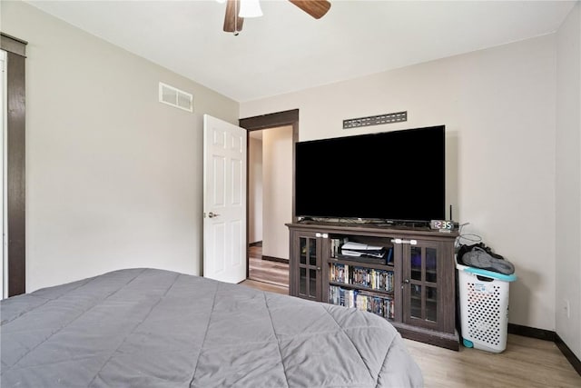 1708 Woodside Ct NW, Cedar Rapids, IA 52405 - bedroom with wood finished floors and a ceiling fan