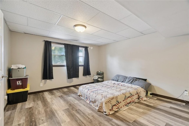 1708 Woodside Ct NW, Cedar Rapids, IA 52405 - bedroom featuring wood finished floors and a drop ceiling