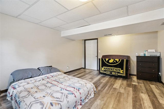 1708 Woodside Ct NW, Cedar Rapids, IA 52405 - bedroom with a drop ceiling and wood finished floors