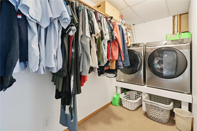 1708 Woodside Ct NW, Cedar Rapids, IA 52405 - laundry room with washing machine and dryer and carpet flooring