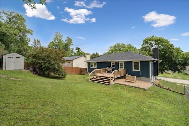 1708 Woodside Ct NW, Cedar Rapids, IA 52405 - back of property featuring a shed, a wooden deck, a chimney, and a fenced backyard