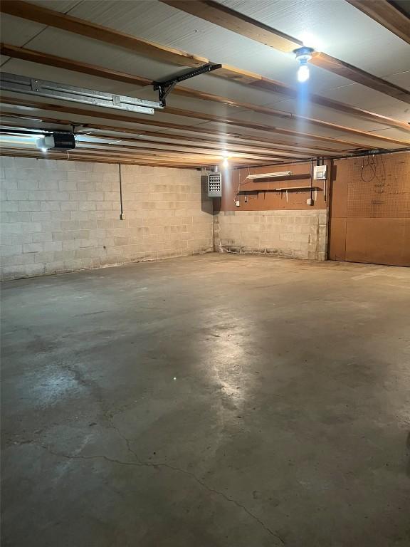 201 S 8th Ave, Vinton, IA 52349 - below grade area featuring concrete block wall and a garage
