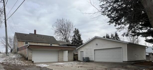 201 S 8th Ave, Vinton, IA 52349 - view of property exterior featuring a detached garage and an outdoor structure