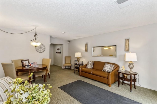 2135 1st Ave SE Unit 125, Cedar Rapids, IA 52402 - living area featuring carpet flooring and a textured ceiling