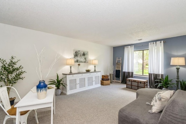 2135 1st Ave SE Unit 125, Cedar Rapids, IA 52402 - living area with a textured ceiling and carpet