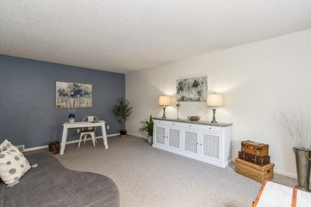 2135 1st Ave SE Unit 125, Cedar Rapids, IA 52402 - living room featuring carpet floors and a textured ceiling