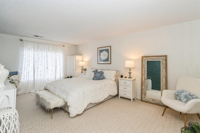 2135 1st Ave SE Unit 125, Cedar Rapids, IA 52402 - bedroom featuring light carpet