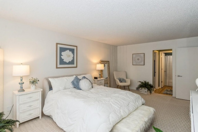 2135 1st Ave SE Unit 125, Cedar Rapids, IA 52402 - bedroom featuring light colored carpet and a textured ceiling