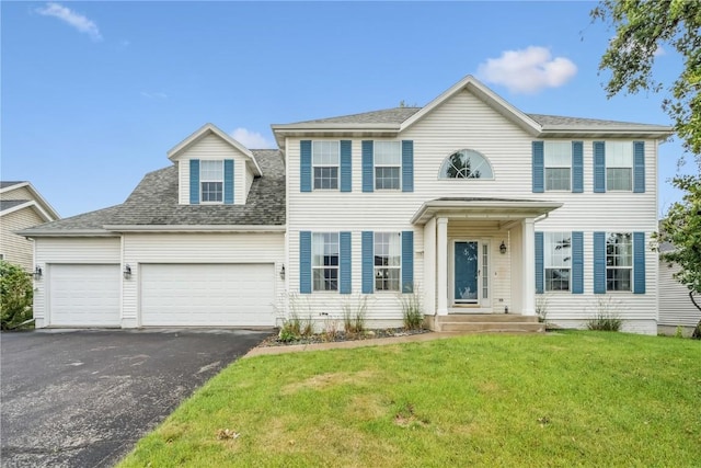 4309 Woodsonia Ct NW, Cedar Rapids, IA 52405 - colonial home with driveway, an attached garage, a front yard, and roof with shingles