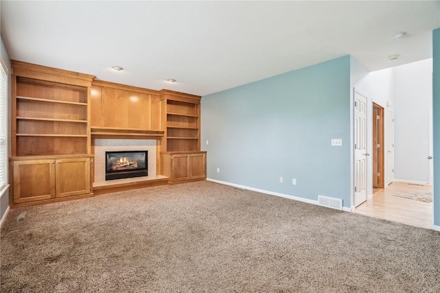 4309 Woodsonia Ct NW, Cedar Rapids, IA 52405 - unfurnished living room featuring light carpet and a fireplace