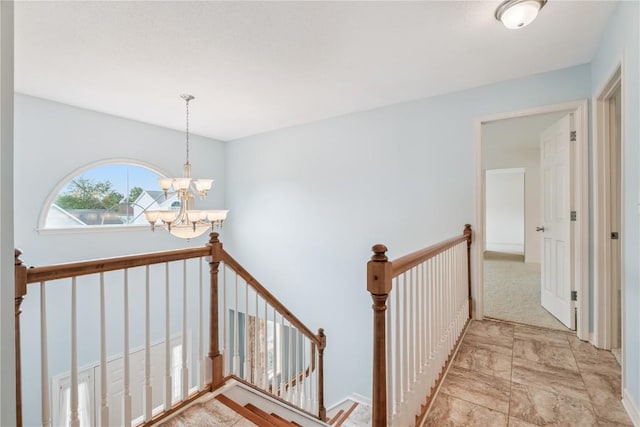 4309 Woodsonia Ct NW, Cedar Rapids, IA 52405 - stairway featuring a chandelier and marble finish floors