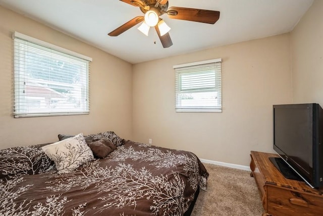 4524 Benton St, Cedar Rapids, IA 52402 - carpeted bedroom featuring baseboards and ceiling fan
