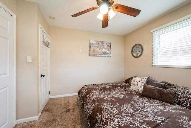 4524 Benton St, Cedar Rapids, IA 52402 - carpeted bedroom with baseboards and a ceiling fan