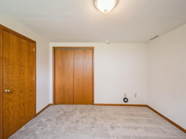 4634 Twin Pine Dr NE, Cedar Rapids, IA 52402 - unfurnished bedroom featuring a closet and carpet