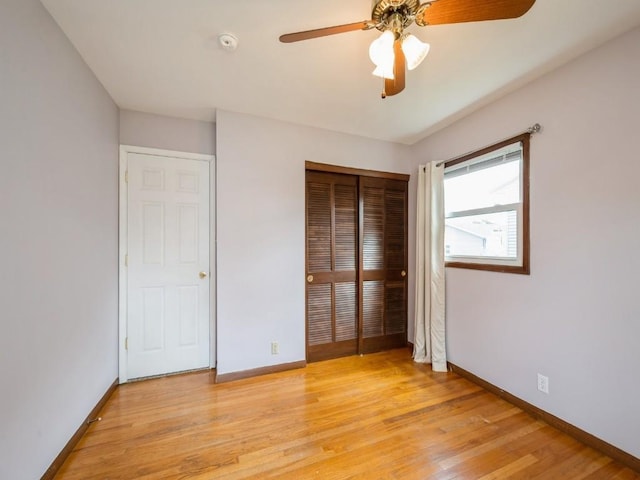 4634 Twin Pine Dr NE, Cedar Rapids, IA 52402 - unfurnished bedroom with light wood finished floors, a closet, and ceiling fan