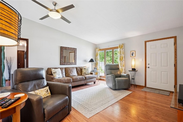 4633 White Pine Dr NE, Cedar Rapids, IA 52402 - living area featuring lofted ceiling, light wood-style flooring, and a ceiling fan