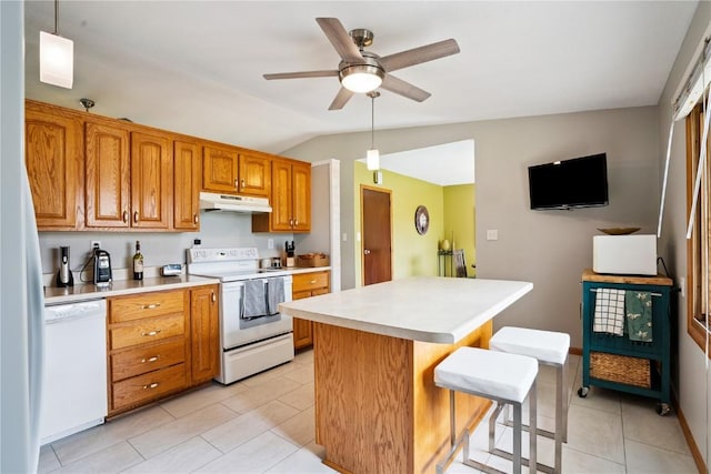 4633 White Pine Dr NE, Cedar Rapids, IA 52402 - kitchen with white appliances, under cabinet range hood, vaulted ceiling, a center island, and light countertops