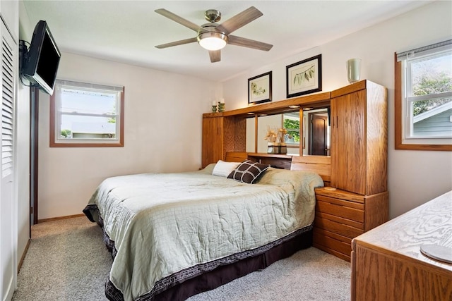 4633 White Pine Dr NE, Cedar Rapids, IA 52402 - bedroom with carpet and ceiling fan