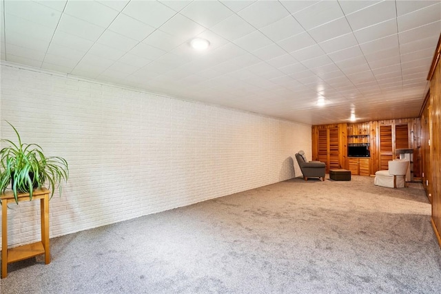 4633 White Pine Dr NE, Cedar Rapids, IA 52402 - unfurnished room with brick wall and carpet