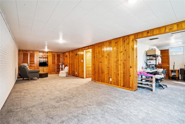 4633 White Pine Dr NE, Cedar Rapids, IA 52402 - carpeted living room with wood walls and brick wall