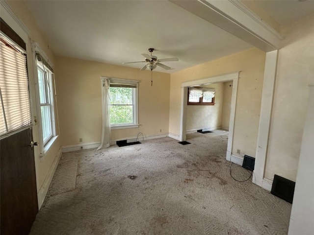 618 18th St SE, Cedar Rapids, IA 52403 - spare room with healthy amount of natural light, carpet, and a ceiling fan