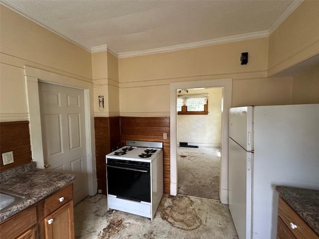 618 18th St SE, Cedar Rapids, IA 52403 - kitchen with white appliances, brown cabinets, ornamental molding, and dark countertops