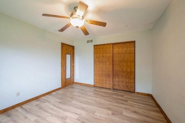 3524 Swallow Ct NE, Cedar Rapids, IA 52402 - unfurnished bedroom with light wood-type flooring, a closet, and a ceiling fan