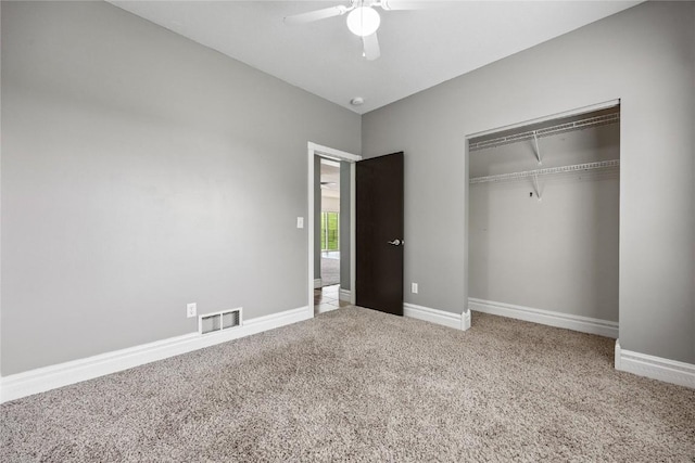 881 Shade Tree Ct, Lisbon, IA 52253 - unfurnished bedroom featuring carpet flooring, a closet, and a ceiling fan