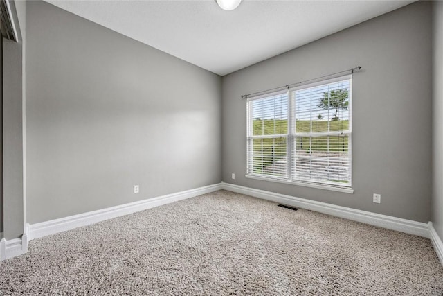 881 Shade Tree Ct, Lisbon, IA 52253 - carpeted spare room featuring baseboards
