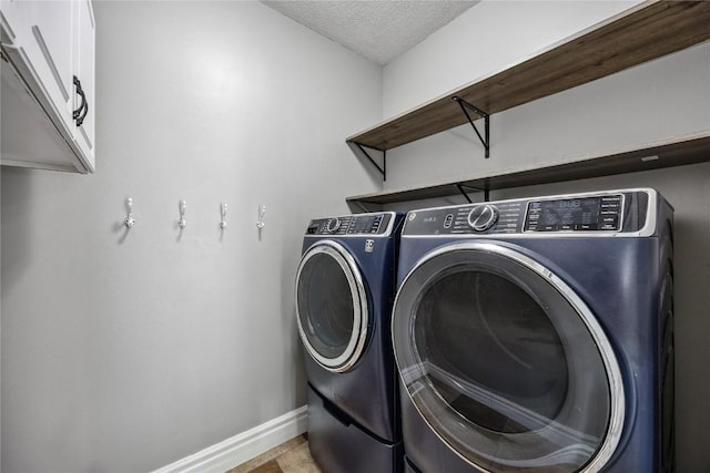 881 Shade Tree Ct, Lisbon, IA 52253 - washroom with a textured ceiling, cabinet space, and independent washer and dryer