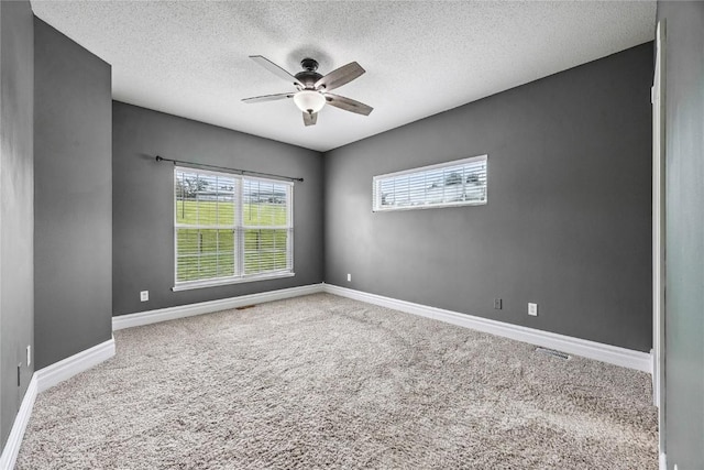 881 Shade Tree Ct, Lisbon, IA 52253 - carpeted spare room featuring ceiling fan and a textured ceiling