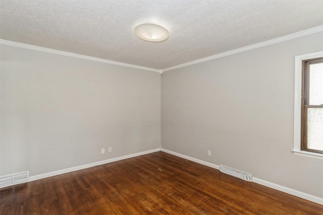1158 Brown Ave NE, Cedar Rapids, IA 52402 - unfurnished room with dark wood-style floors, ornamental molding, and a textured ceiling