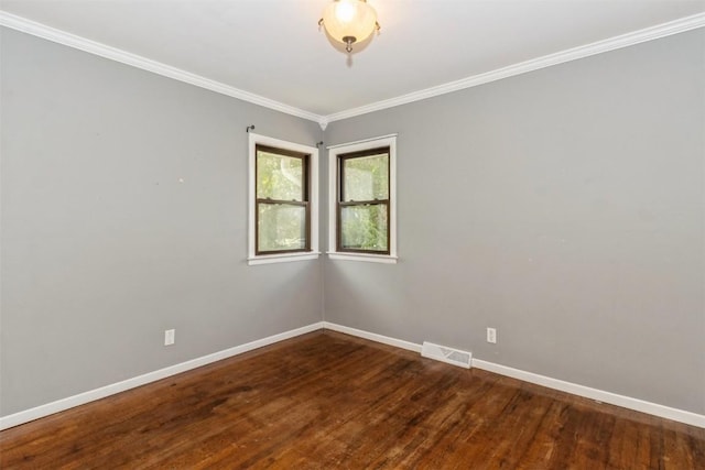 1158 Brown Ave NE, Cedar Rapids, IA 52402 - unfurnished room with wood finished floors and crown molding