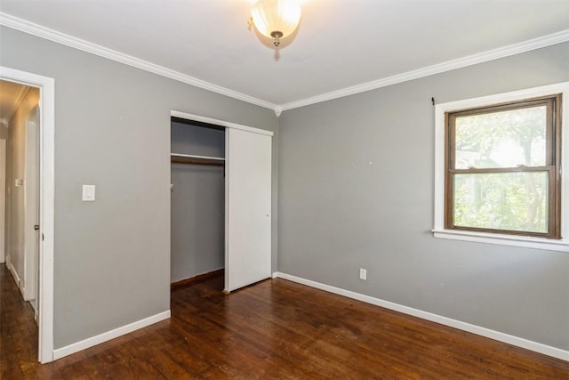 1158 Brown Ave NE, Cedar Rapids, IA 52402 - unfurnished bedroom featuring crown molding, wood finished floors, and a closet