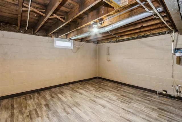 1158 Brown Ave NE, Cedar Rapids, IA 52402 - below grade area with wood finished floors