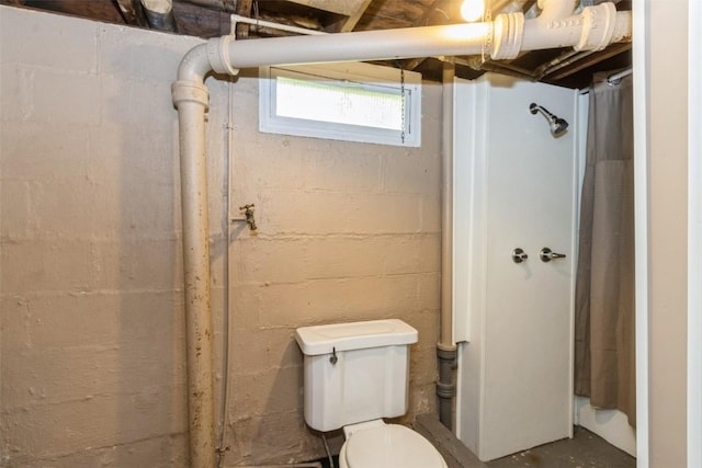 1158 Brown Ave NE, Cedar Rapids, IA 52402 - bathroom with a shower with shower curtain and concrete floors