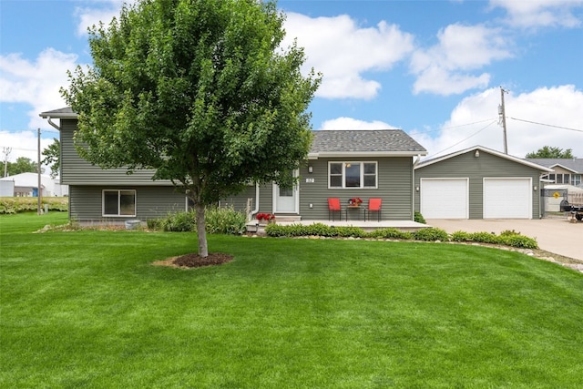 52 Thompson Dr, Palo, IA 52324 - view of front of house featuring driveway, an outdoor structure, and a front lawn