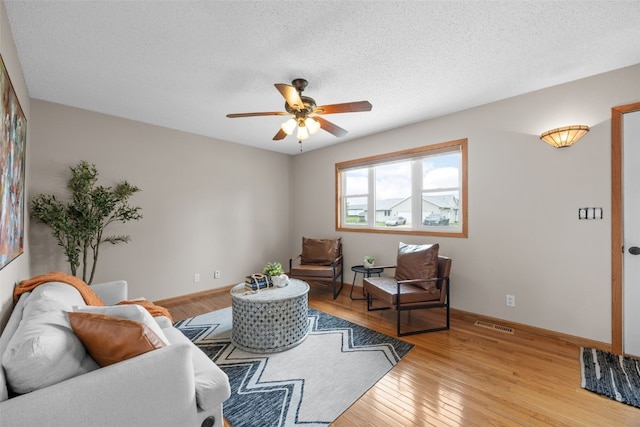 52 Thompson Dr, Palo, IA 52324 - living area with a ceiling fan, light wood finished floors, and a textured ceiling