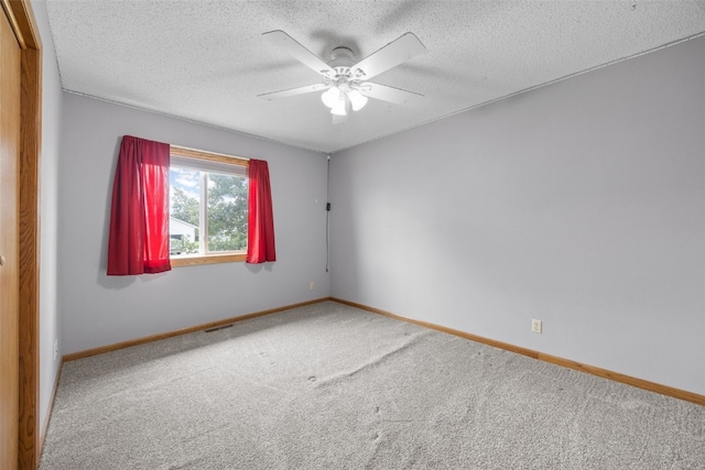 52 Thompson Dr, Palo, IA 52324 - carpeted empty room featuring a ceiling fan and a textured ceiling